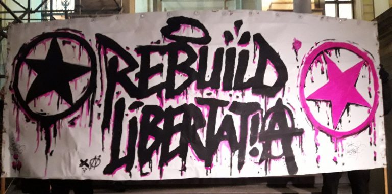 Αλληλεγγύη στους 12 συντρόφους/ισσες που διώκονται για την ανοικοδόμηση της κατάληψης Libertatia